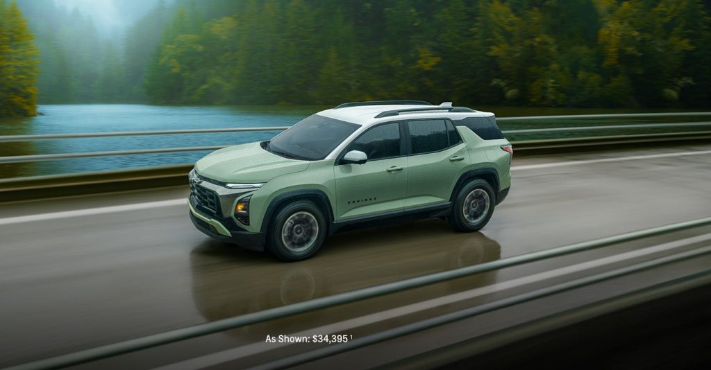 2025 Chevy Equinox driving on a bridge