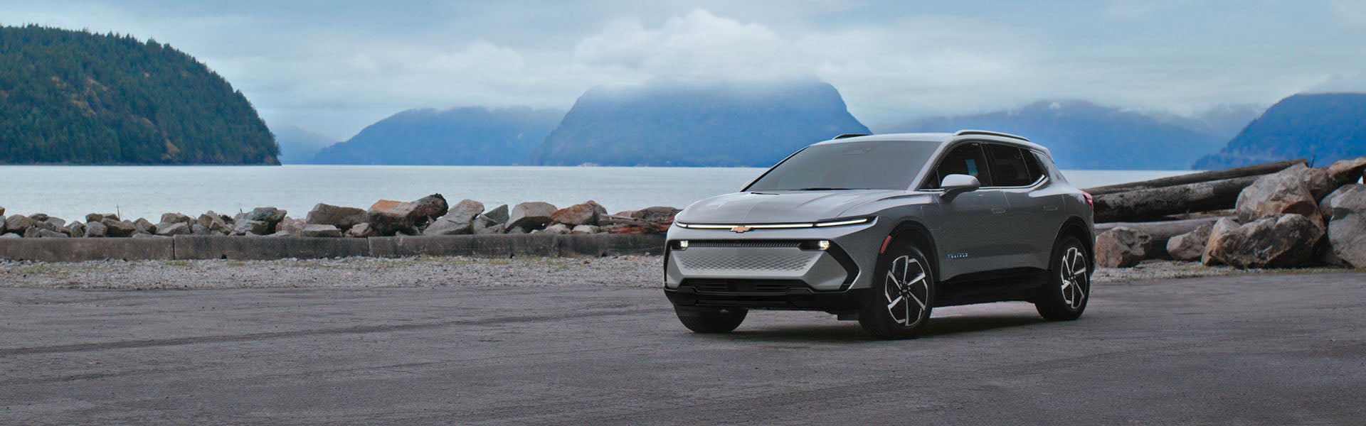 A 2026 Chevy Equinox EV parked, showcasing its sleek design and modern features in a bright outdoor setting.