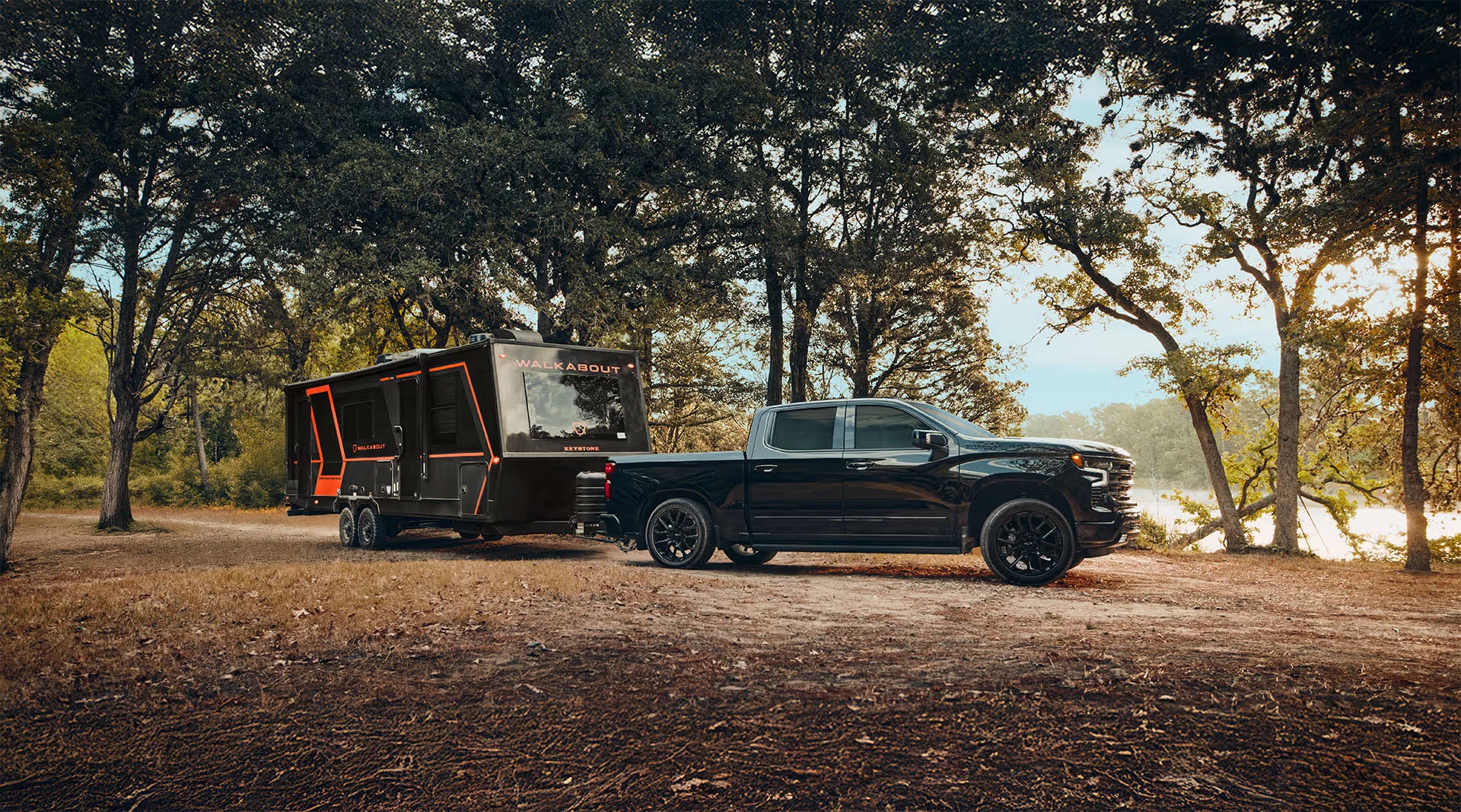 2026 Chevy Silverado pulling a motor home by a lake